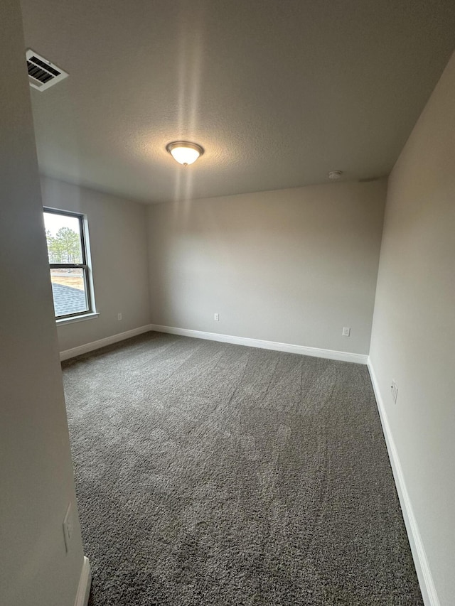 empty room with carpet flooring