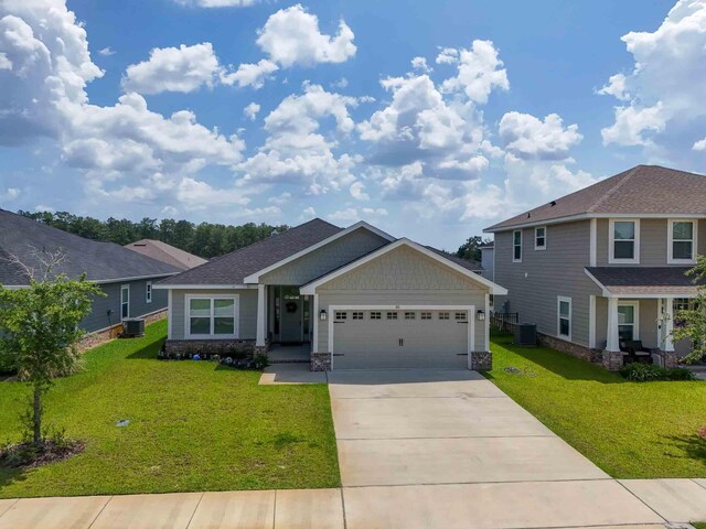 craftsman-style house with a garage, central AC, and a front lawn