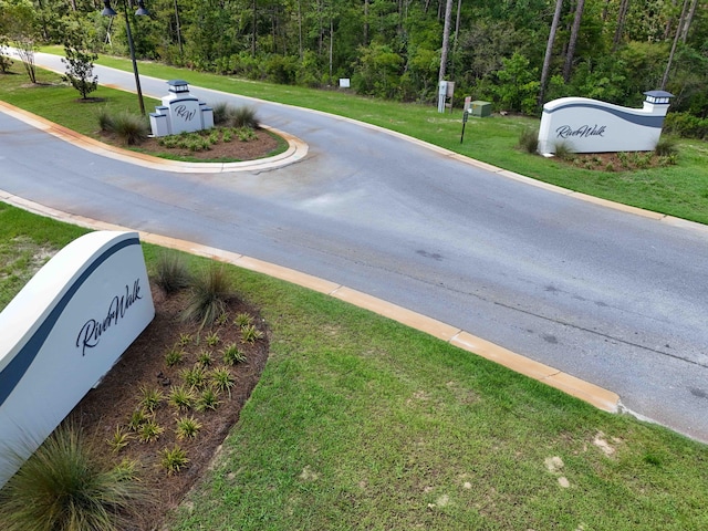 view of road with curbs