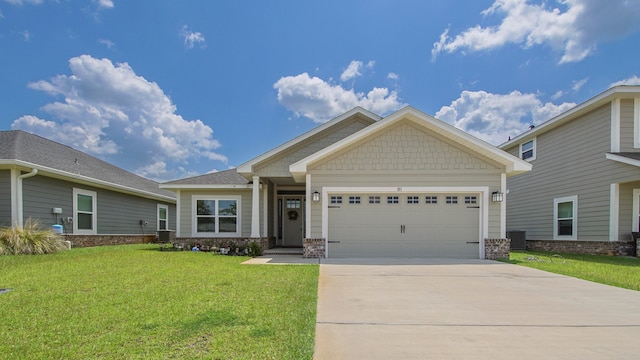 craftsman inspired home featuring a garage, cooling unit, and a front yard