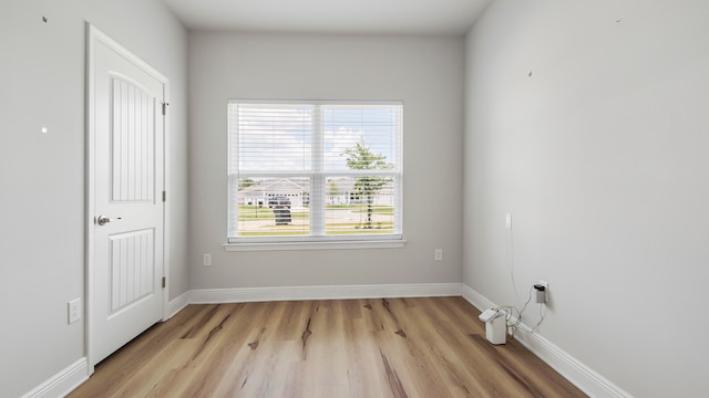 spare room with light hardwood / wood-style flooring