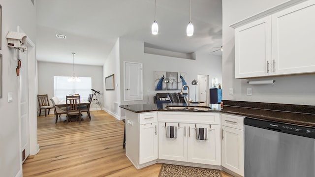 kitchen with sink, pendant lighting, light hardwood / wood-style floors, white cabinetry, and dishwasher