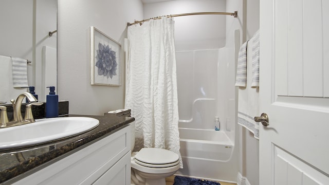 full bath with toilet, vanity, and shower / tub combo with curtain