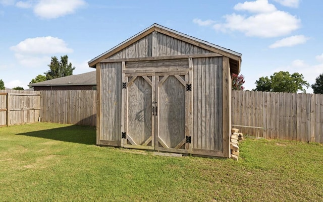 view of outdoor structure with a lawn