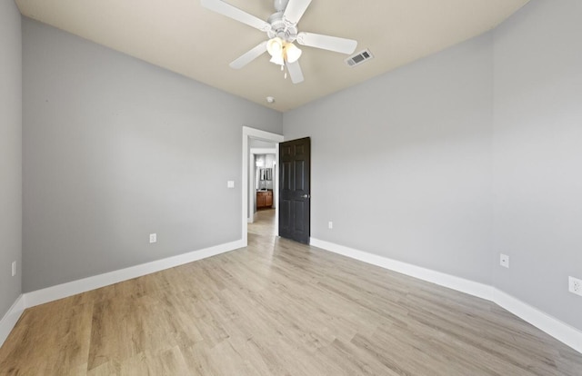 spare room with light hardwood / wood-style flooring and ceiling fan