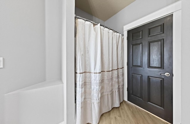 bathroom featuring hardwood / wood-style flooring