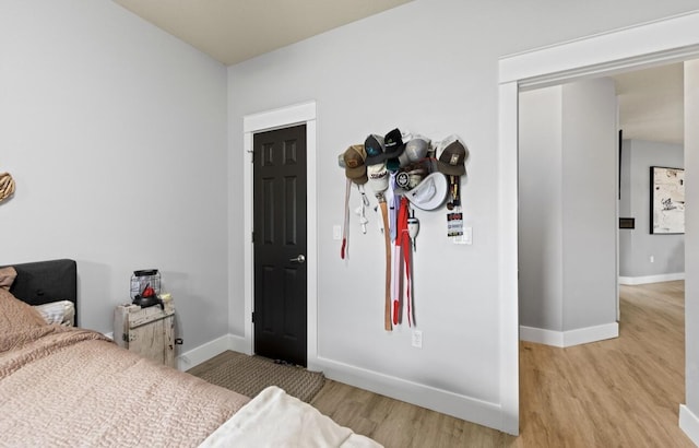 bedroom with light hardwood / wood-style flooring