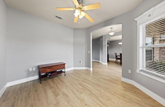 spare room with ceiling fan and light hardwood / wood-style floors