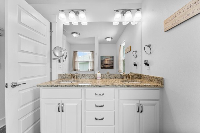 bathroom with dual vanity