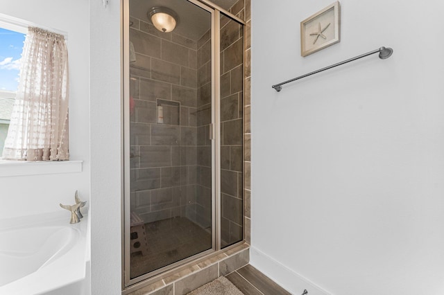 bathroom featuring plus walk in shower