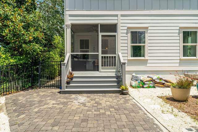 entrance to property featuring a patio area