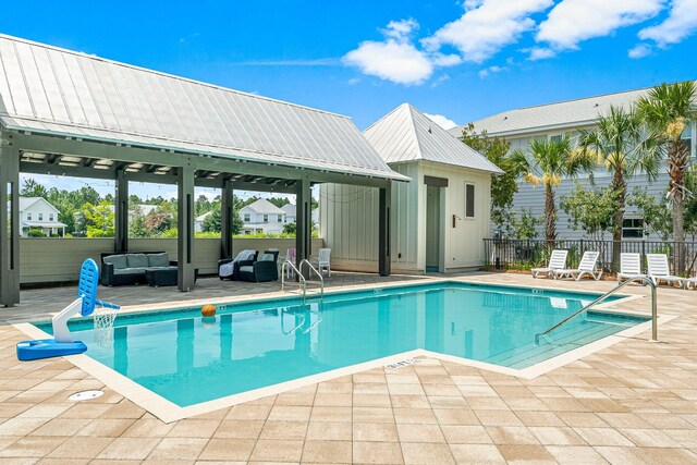 view of pool featuring a patio, a gazebo, and an outdoor hangout area