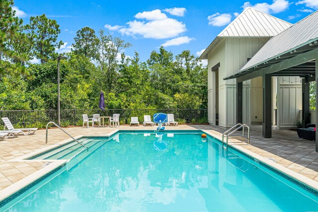 view of swimming pool featuring a patio