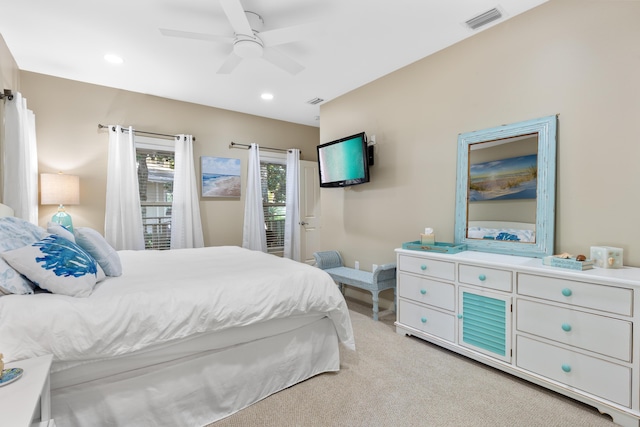 bedroom featuring ceiling fan and light colored carpet