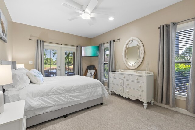 bedroom featuring ceiling fan, light colored carpet, access to outside, and french doors