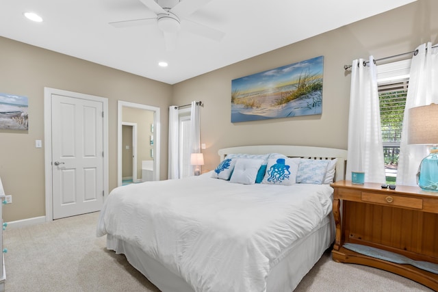 bedroom featuring light colored carpet and ceiling fan