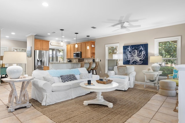 tiled living room featuring ceiling fan and crown molding