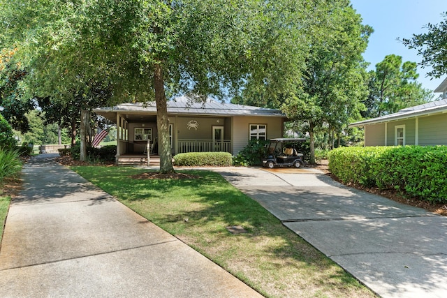 view of front facade with covered porch and a front yard