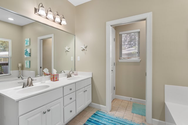 bathroom featuring tile patterned flooring and vanity