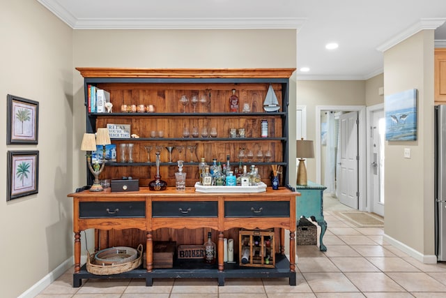 bar featuring stainless steel fridge, light tile patterned flooring, and ornamental molding