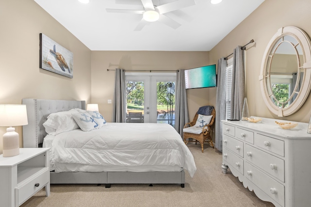 carpeted bedroom featuring access to exterior, ceiling fan, and french doors