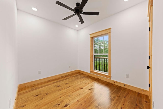 spare room with wood-type flooring and ceiling fan