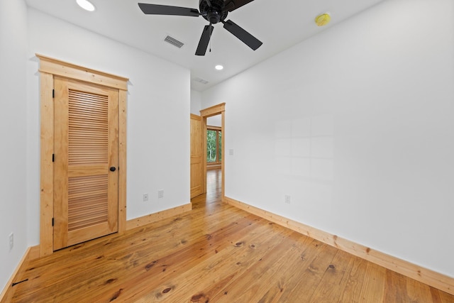 unfurnished room featuring hardwood / wood-style flooring and ceiling fan