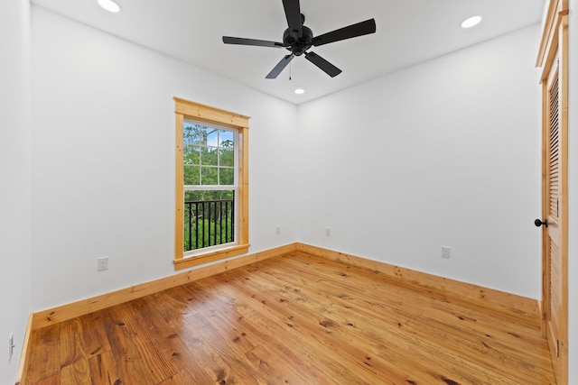 empty room featuring ceiling fan and hardwood / wood-style floors