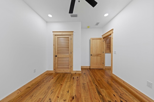 unfurnished bedroom featuring ceiling fan and light wood-type flooring