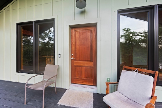 property entrance with a wooden deck