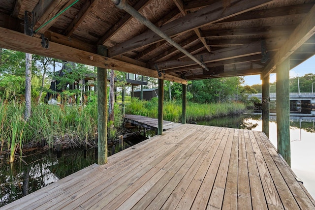 dock area featuring a water view