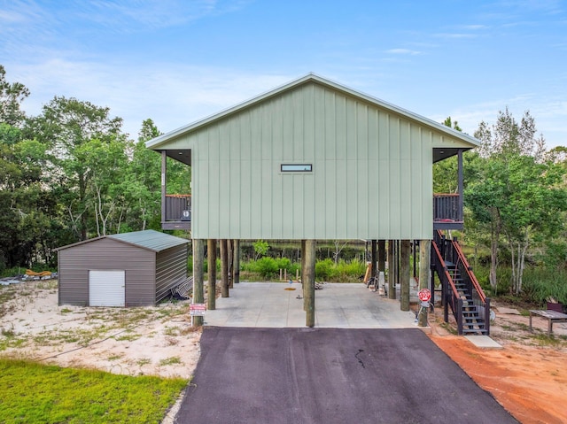 view of outbuilding featuring a carport and a garage