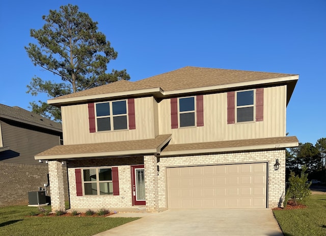 view of front facade featuring central AC and a garage