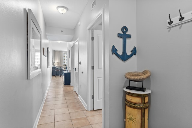 hallway with light tile patterned flooring