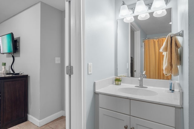 bathroom with tile patterned floors and vanity