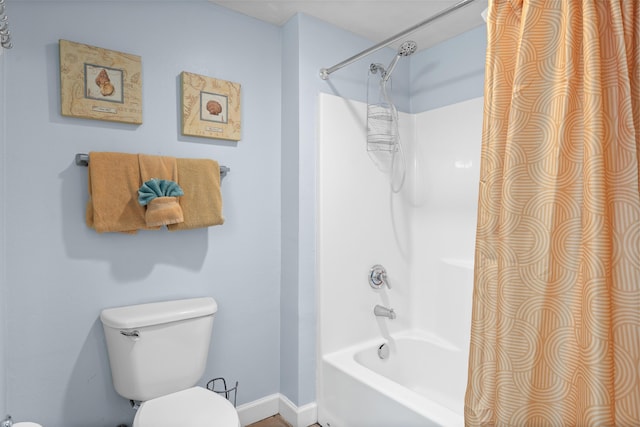 bathroom with toilet and bathtub / shower combination