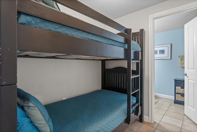 bedroom featuring light tile patterned flooring