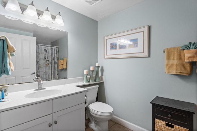 bathroom featuring toilet, vanity, tile patterned floors, and a shower with curtain