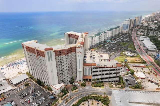 bird's eye view featuring a beach view and a water view