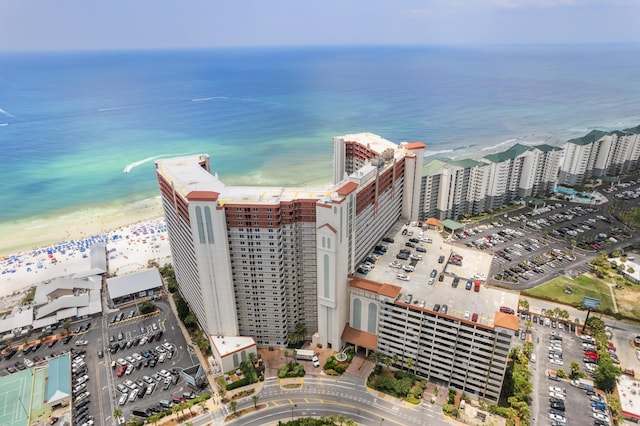 birds eye view of property with a view of the beach and a water view