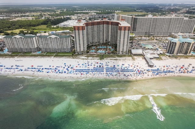 birds eye view of property featuring a water view and a view of the beach