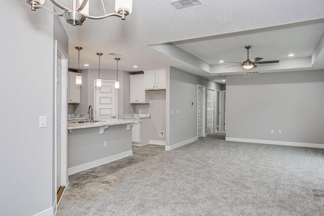 675 Passion Flower St, Defuniak Springs, FL 32433 - unfurnished living room featuring recessed lighting, ceiling fan, baseboards, a sink, and light colored carpet