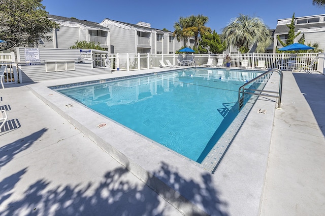 view of swimming pool with a patio