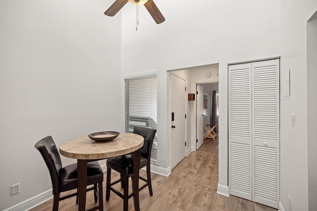 dining room with light hardwood / wood-style flooring and ceiling fan