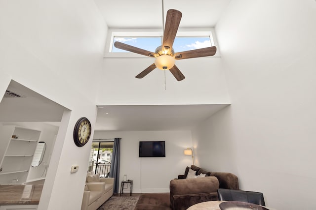 living room featuring high vaulted ceiling and ceiling fan