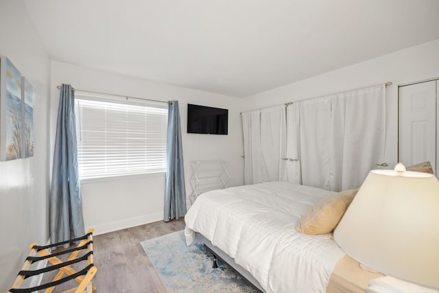 bedroom with light wood-type flooring