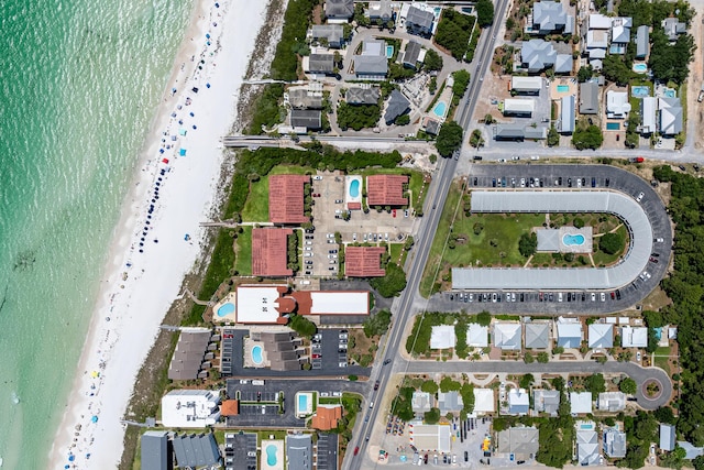 drone / aerial view featuring a view of the beach and a water view