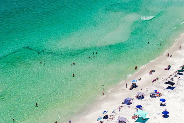 bird's eye view with a beach view and a water view