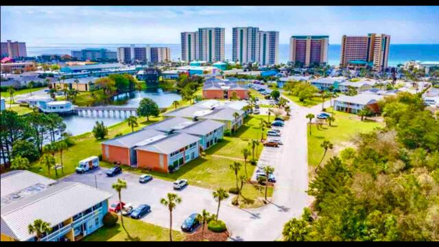 birds eye view of property with a view of city and a water view