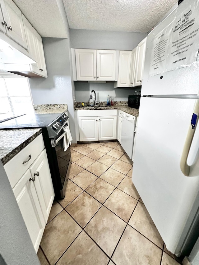 kitchen with a textured ceiling, black appliances, white cabinetry, a sink, and light tile patterned flooring